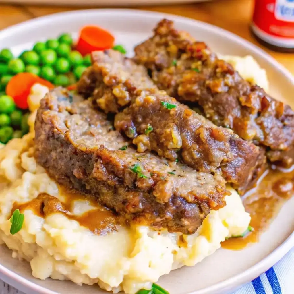 serving of meatloaf with Stove Top stuffing and brown gravy