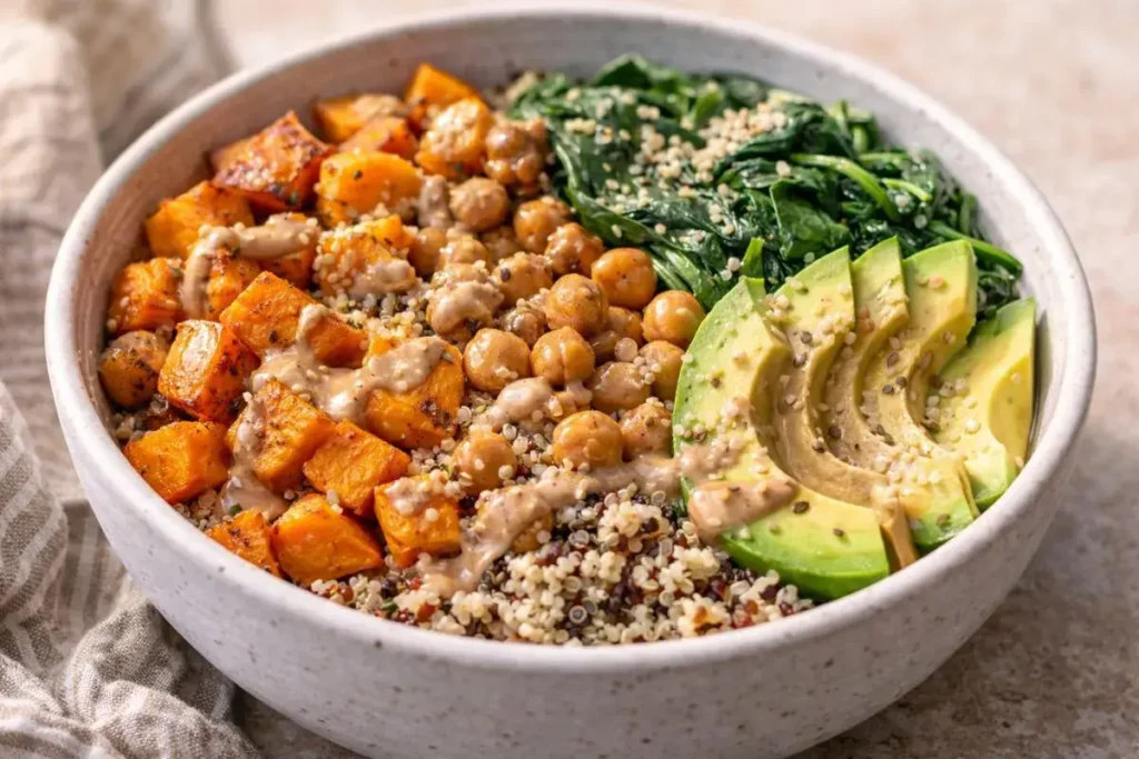 Quinoa Sweet Potato Bowls with roasted sweet potatoes, quinoa, and almond dressing
