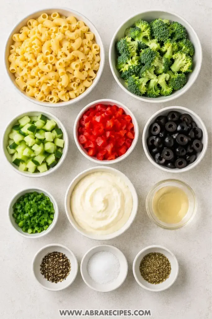 Ingredients for creamy pasta salad laid out on table