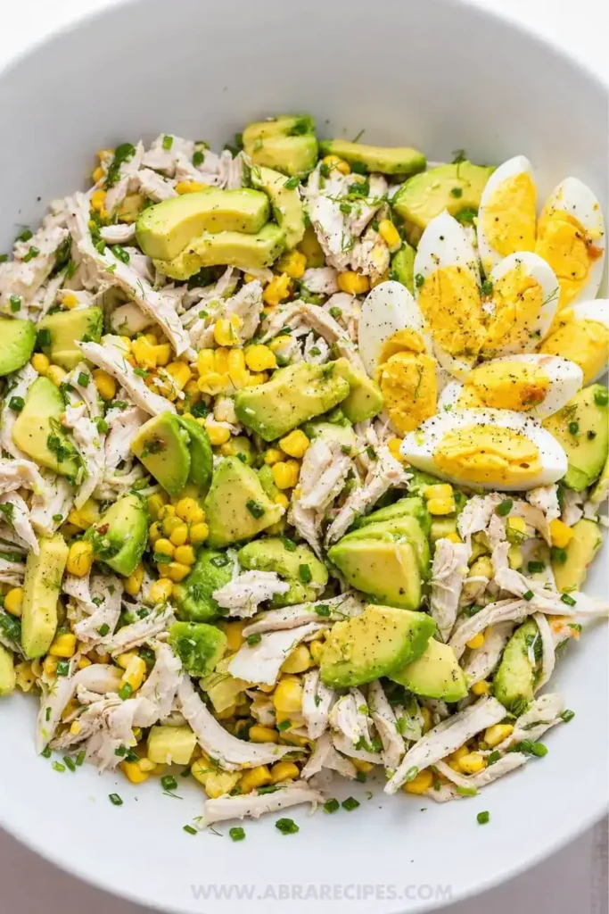 Avocado chicken salad served in lettuce wraps and croissants for healthy lunch