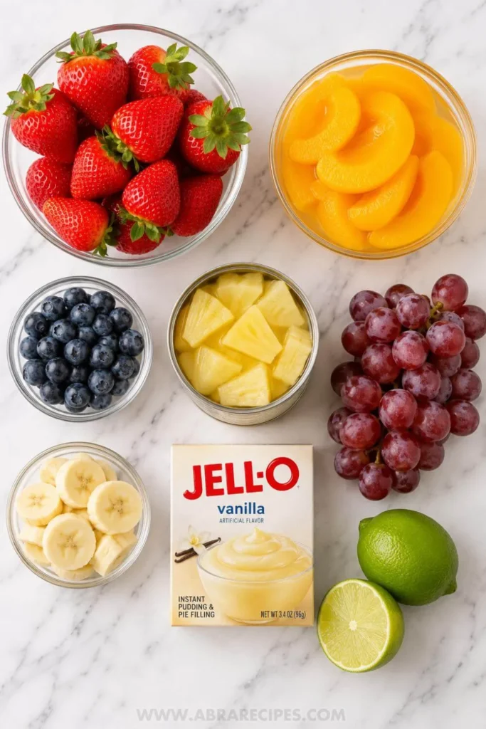 ingredients for fruit salad with vanilla pudding on kitchen counter