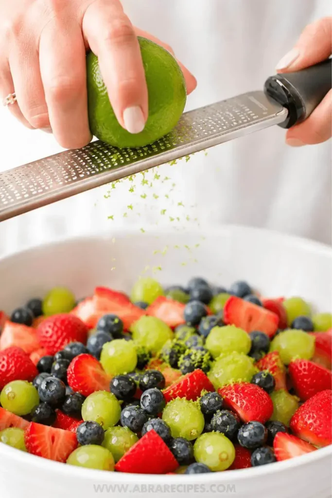 honey lime fruit salad zesting lime