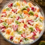 Bowl of Hawaiian Cheesecake Salad with tropical fruit and creamy filling